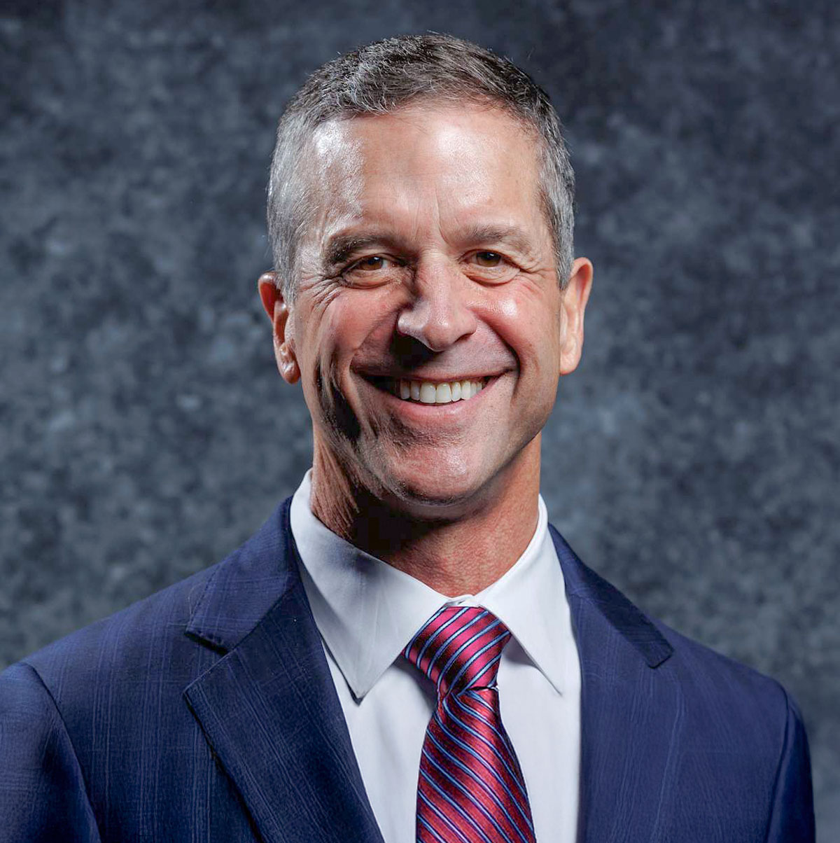 NFL coach John Harbaugh speaking at leadership and motivation conference