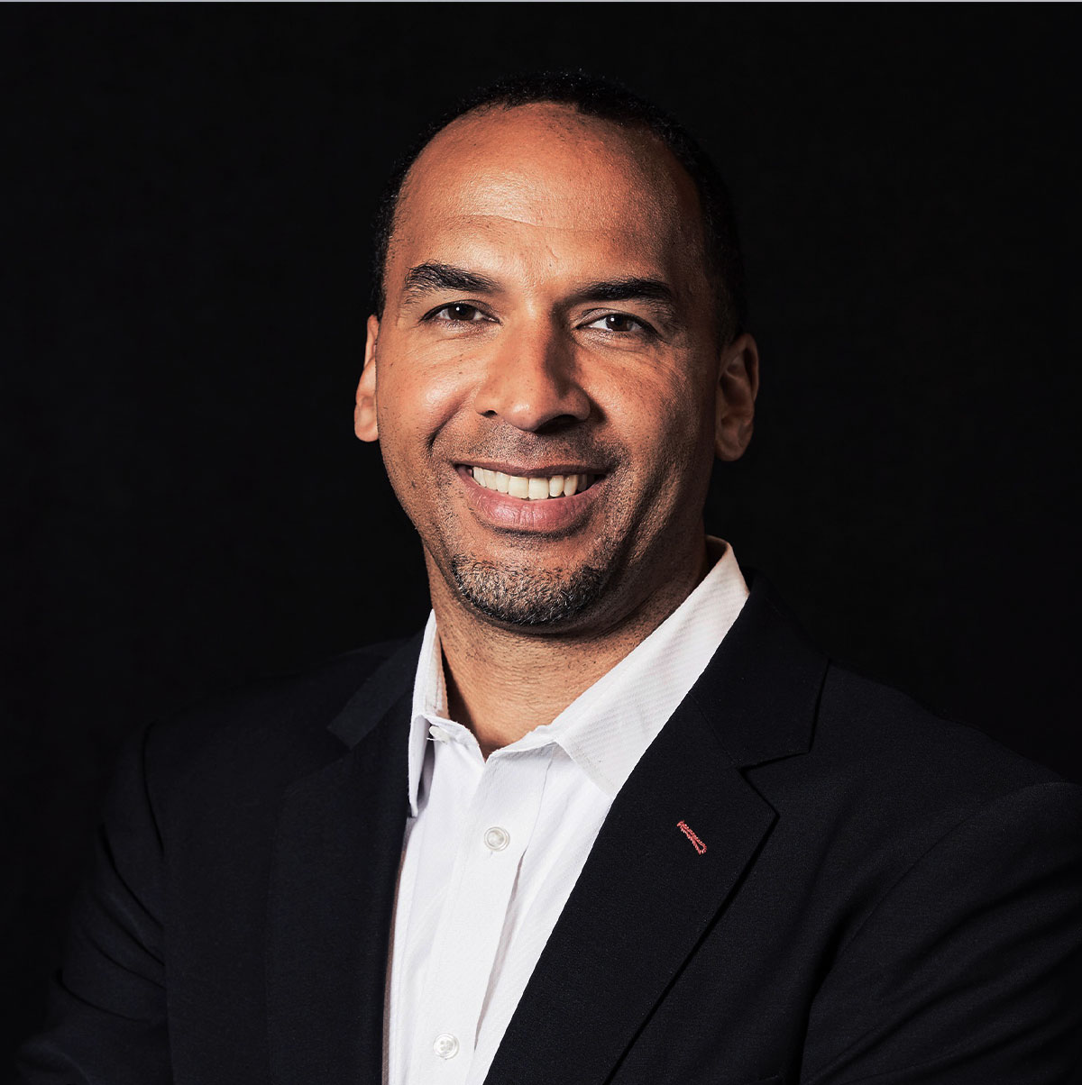 Nico Harrison inspiring audience with lessons on leadership, teamwork, and strategic thinking